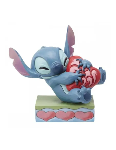 Figura enesco disney stitch abrazando un corazón