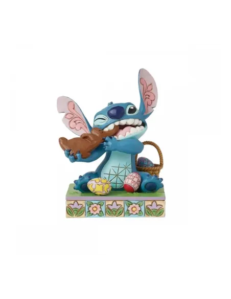 Figura enesco diseny stitch comiendo conejo de chocolate con huevos